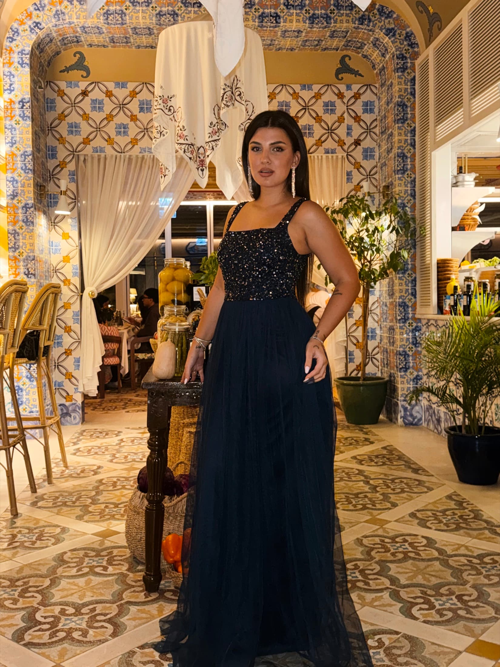 Carol Magagna in an evening gown at a luxury Dubai venue